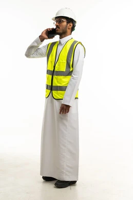 Saudi Engineer in Safety Gear Talking on Mobile Phone