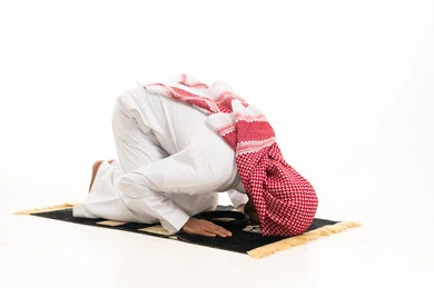 Muslim Man in Sujud Prostration on White Background