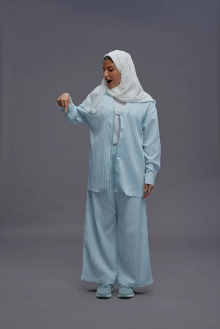 Saudi Woman in Hijab Pointing Down with Surprised Face