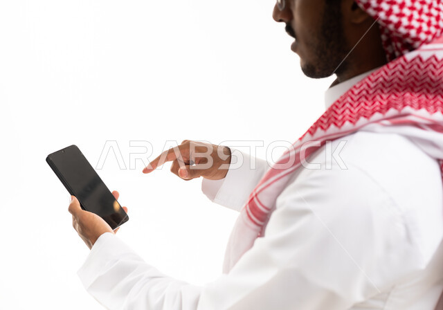Saudi Man Interacting with Smartphone on White Background