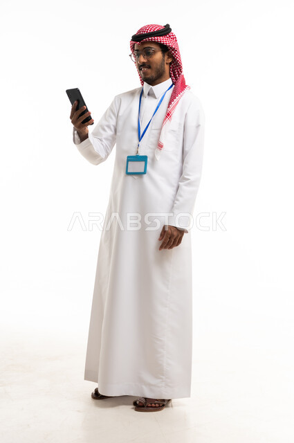 Saudi Businessman Using Smartphone on White Background