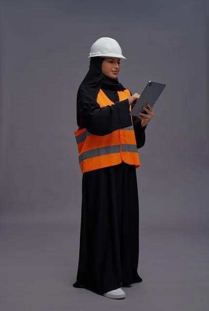 Saudi Female Engineer with Tablet in Studio Setting