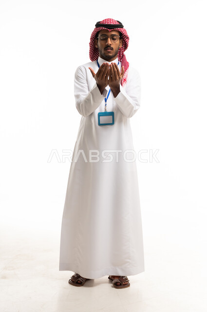 Saudi Man in Traditional Thobe Praying on White Background