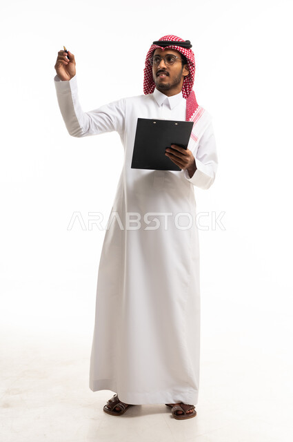 Saudi Man in Thobe Writing with Clipboard