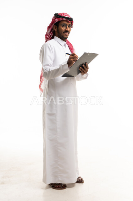 Saudi Professional Man in Thobe Holding Clipboard