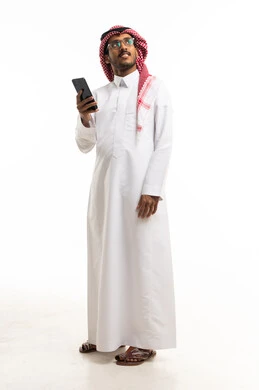 Saudi Man in Traditional Thobe Holding Smartphone Studio