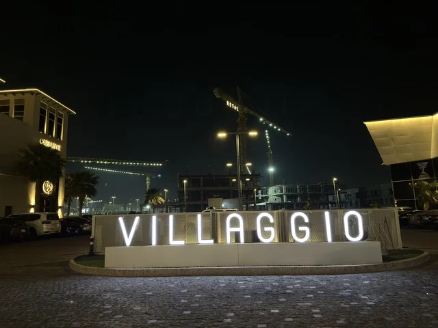 Villaggio Restaurant Sign at Night Eastern Province