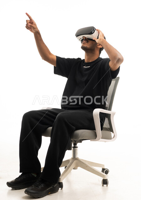 Saudi Man Using Virtual Reality Headset on White Background