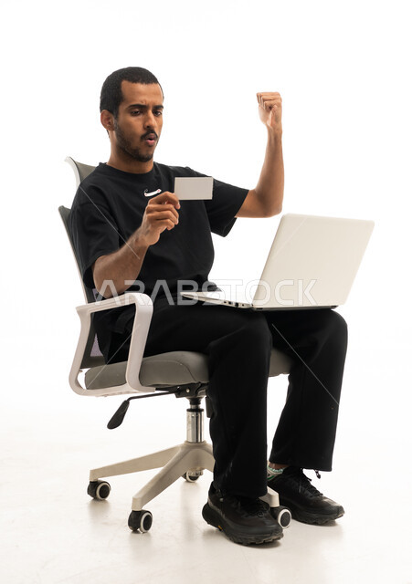 Arab Man Celebrating Online Payment with Laptop