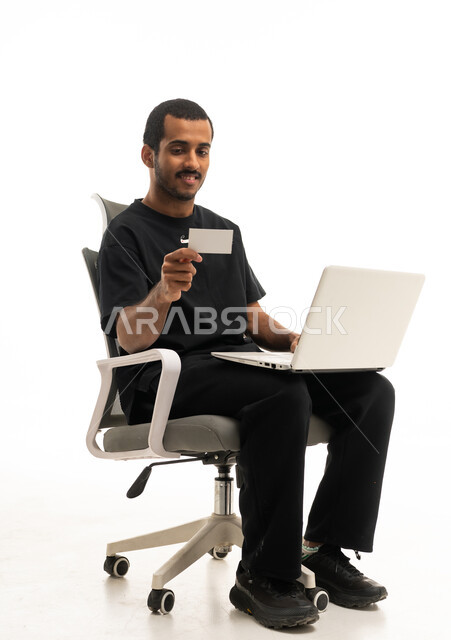 Arab Man Holding Laptop and Card on White Background