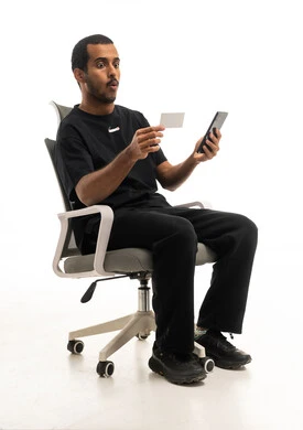Surprised Arab Man Holding Smartphone and Credit Card