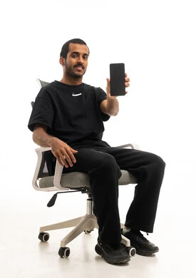 Saudi Man Holding Smartphone on Office Chair