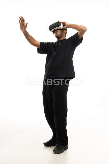 Saudi Man Using Virtual Reality Headset on White Background
