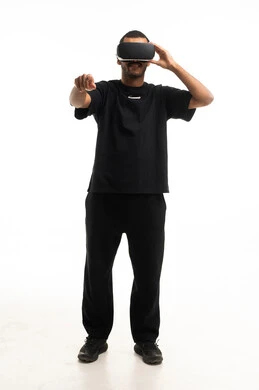 Saudi Man Using VR Headset on White Background