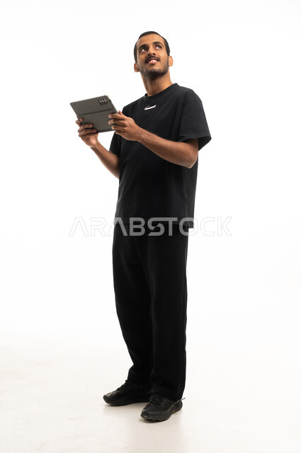 Saudi Man with Tablet on White Background