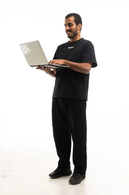 Saudi Man Using Laptop on White Background