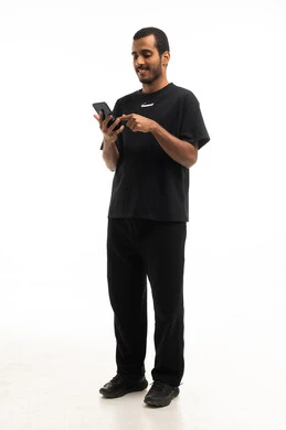 Saudi Man Using Smartphone on White Background