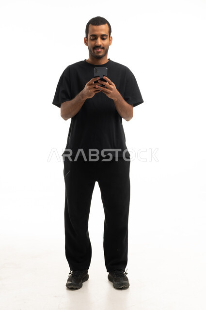 Saudi Man Using Smartphone on White Background