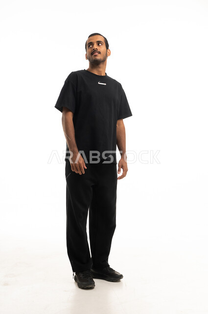 Young Saudi Man Standing in White Studio Portrait