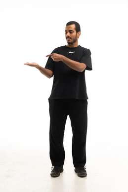 Saudi Man Pointing to Open Hand on White Background