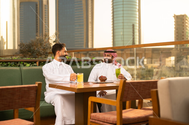 Arab Men at Outdoor City Restaurant During Sunset