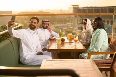 Saudi Friends at Rooftop Restaurant during Sunset