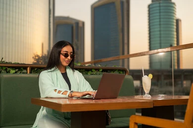 Saudi Businesswoman Working on Laptop in Riyadh Cafe
