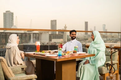 Saudi Friends Dining at Riyadh Rooftop Restaurant