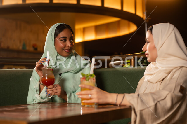 Arab Women in Hijab Dining at Restaurant Night