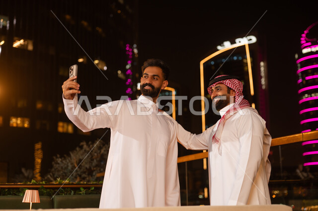 Saudi Men Taking Selfie in Riyadh at Night