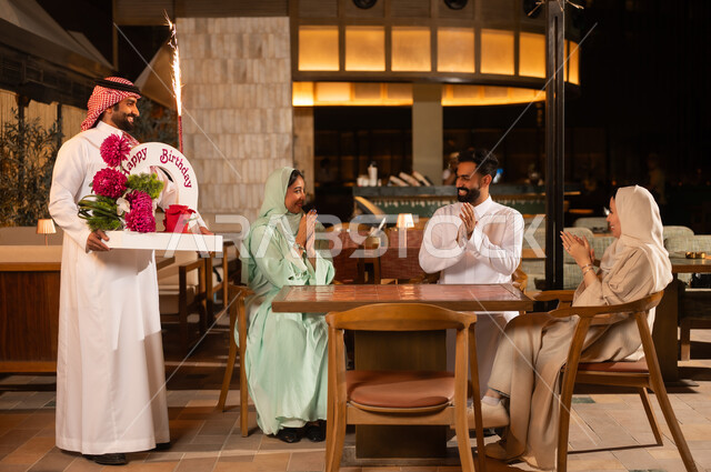 Saudi Friends Celebrating Birthday in Restaurant