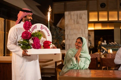 Saudi Couple Celebrating Birthday in Restaurant