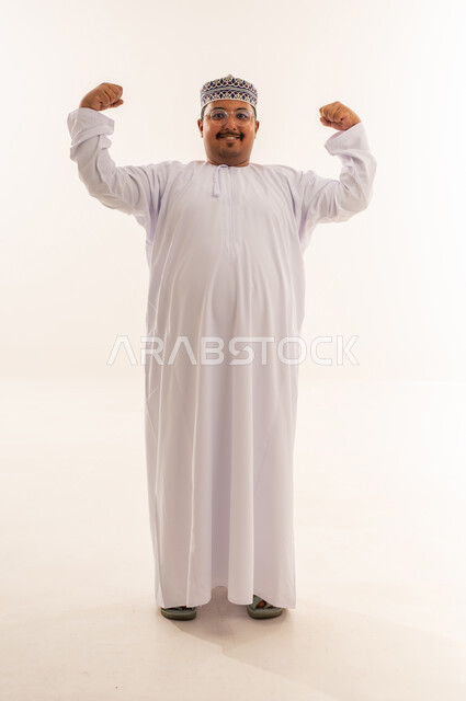 Omani Man Flexing Muscles in Traditional Dishdasha