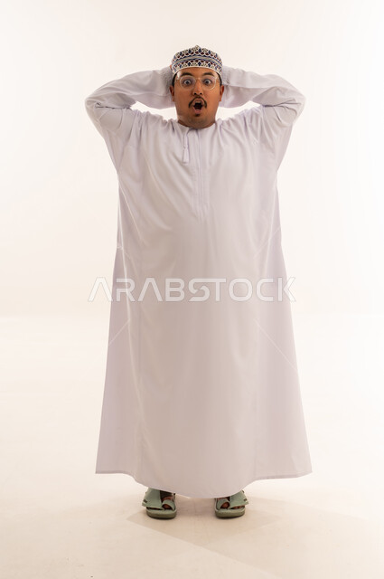 Shocked Omani Man in Traditional Dishdasha on White Background