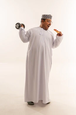 Omani Man with Pizza and Dumbbell in Studio