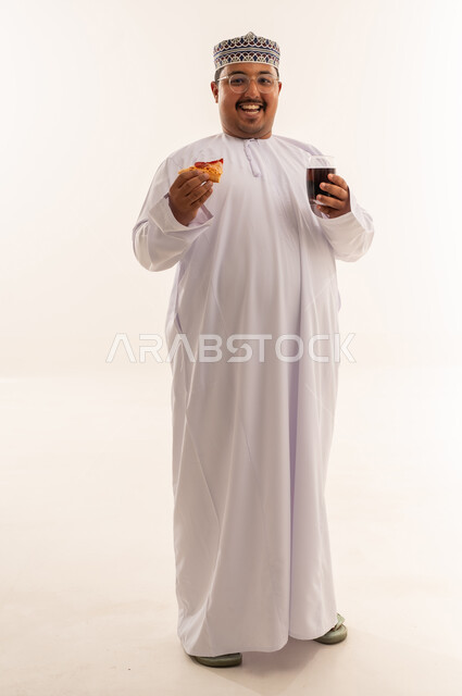 Omani Man with Pizza and Soda in Studio