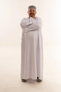 Omani Man in Traditional Dishdasha on White Background