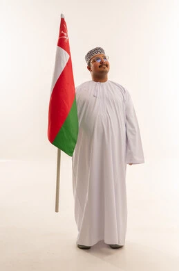 Omani Man Holding National Flag on White Background