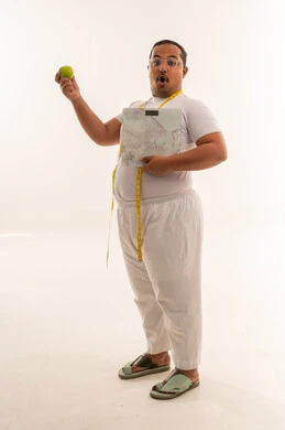 Saudi Overweight Man with Scale and Apple