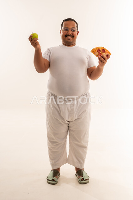 Arab Overweight Man Choosing Between Apple and Pizza