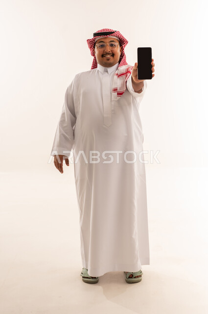 Saudi Man Holding Smartphone on White Background