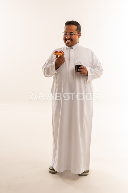 Overweight Saudi Man Eating Pizza Studio Shot