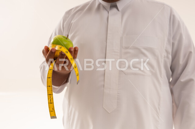 Arab Man with Green Apple and Measuring Tape