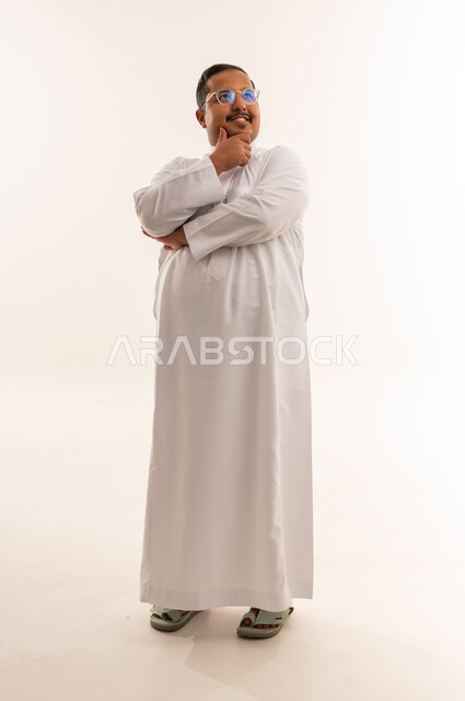 Overweight Arab Man in White Thobe Thinking Studio