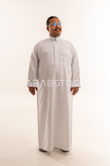 Smiling Saudi Man in White Thobe Studio Shot