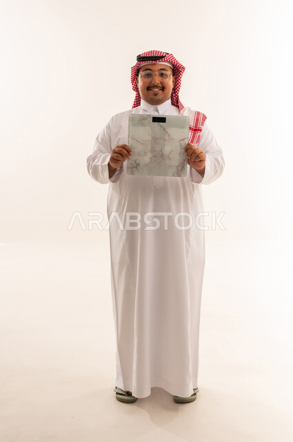 Saudi Man with Digital Weight Scale on White Background