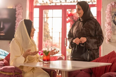 Saudi Women Having a Conversation in a Cafe