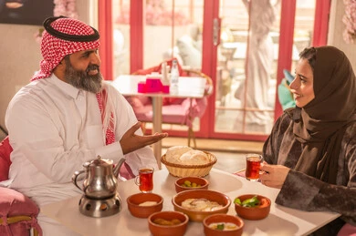 Saudi Couple Eating Traditional Middle Eastern Breakfast