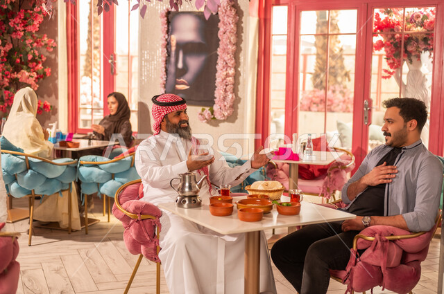 Saudi Men Restaurant Pink Floral Decor Conversation
