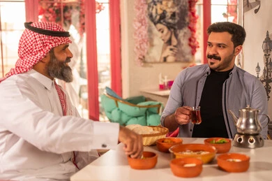 Saudi Men Having Traditional Breakfast in Restaurant